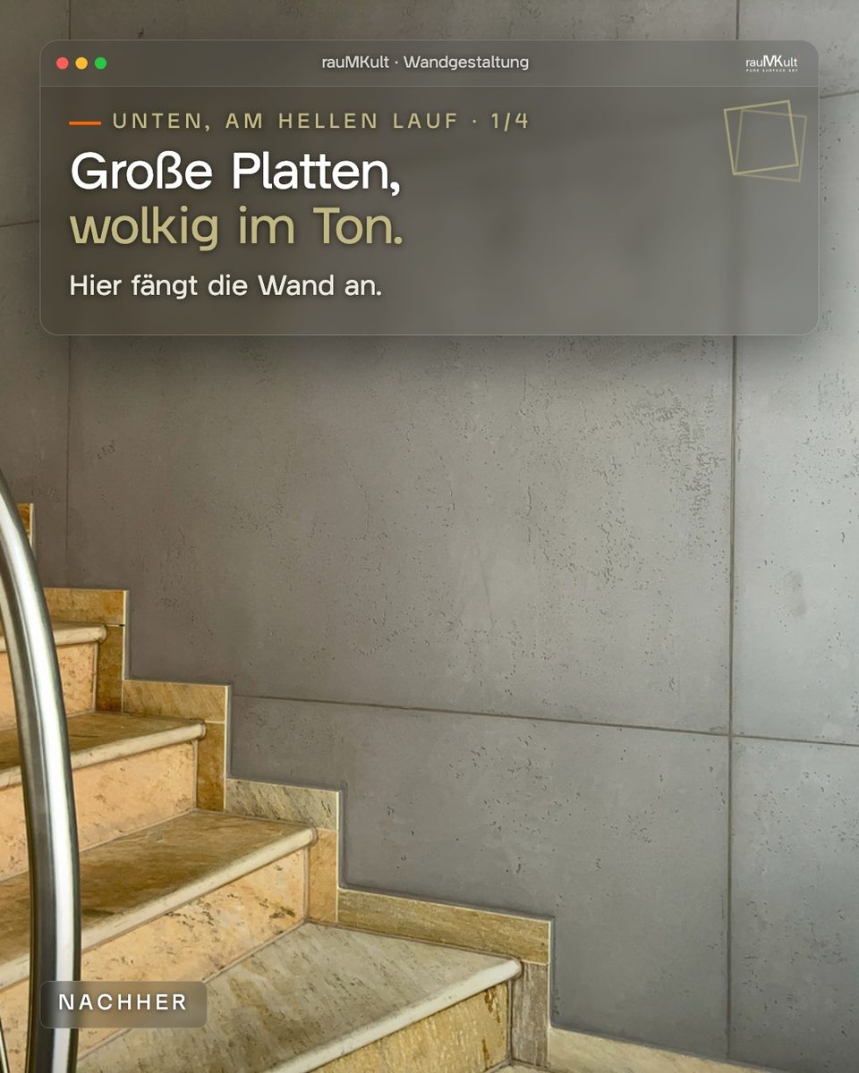 Wand in Schalbetonoptik mit großen Platten und wolkigem Grauton neben dem unteren Treppenlauf