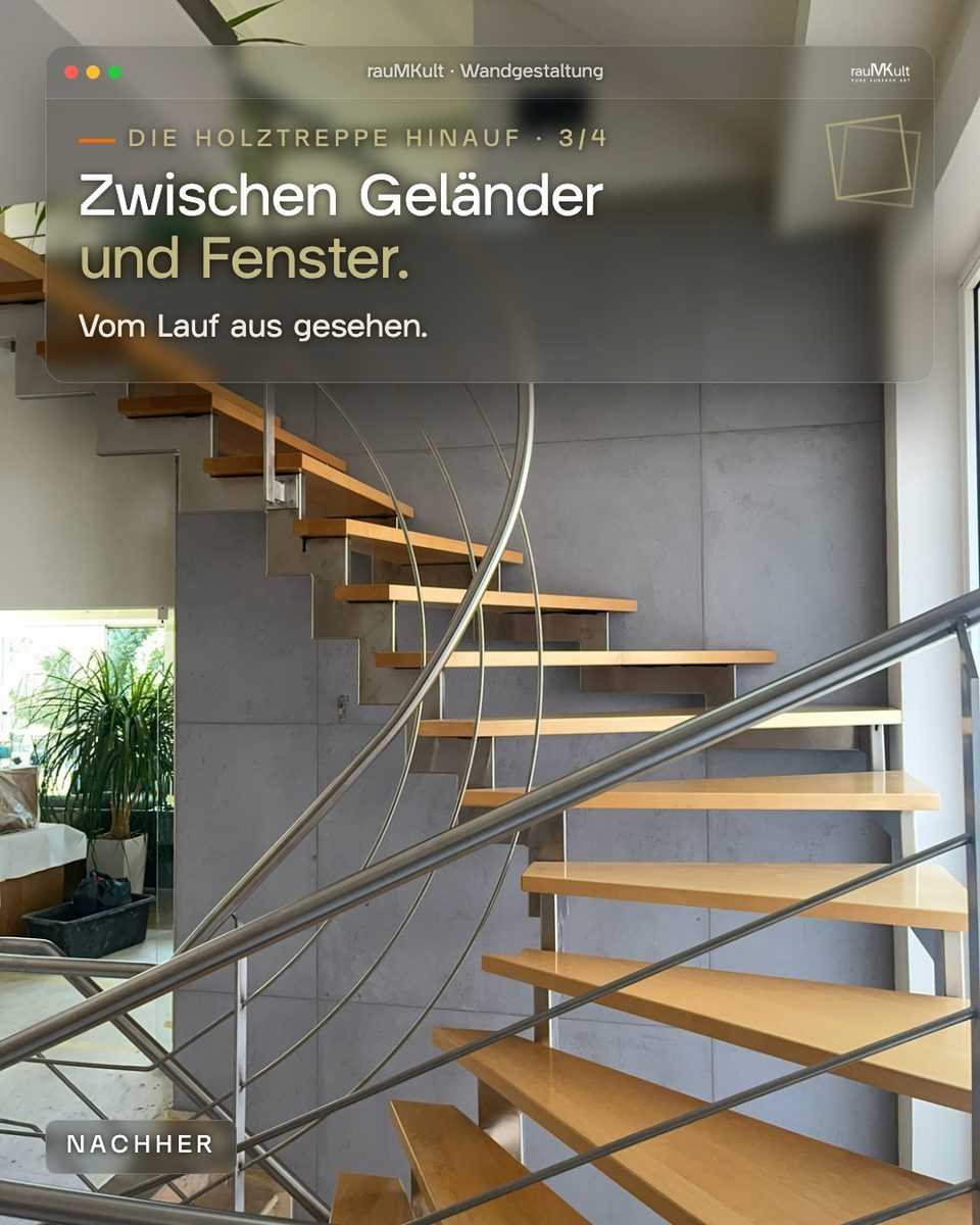 Wand in Betonoptik zwischen Geländer und Fenster, vom Treppenlauf aus gesehen