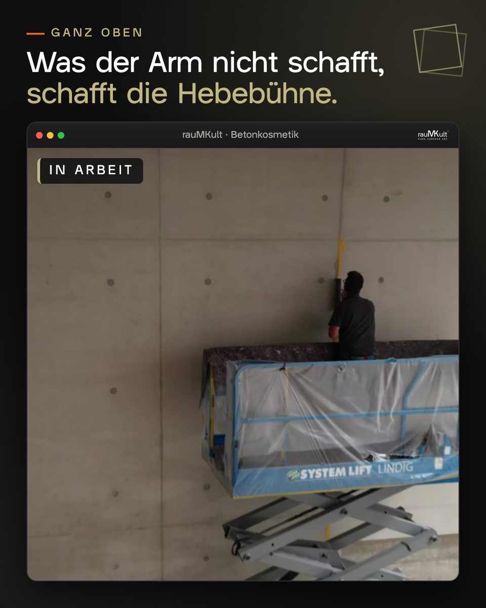 Arbeit an der Sichtbetonwand von der Hebebühne aus